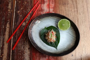 Kingfish Tartare pomelo, Green mango, shallots on betel leaf